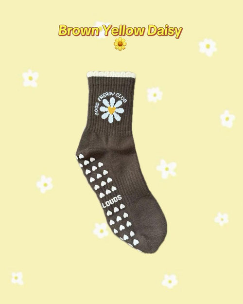 Brown PILATES GRIP socks with white daisy design, butter yellow line detail and antislip