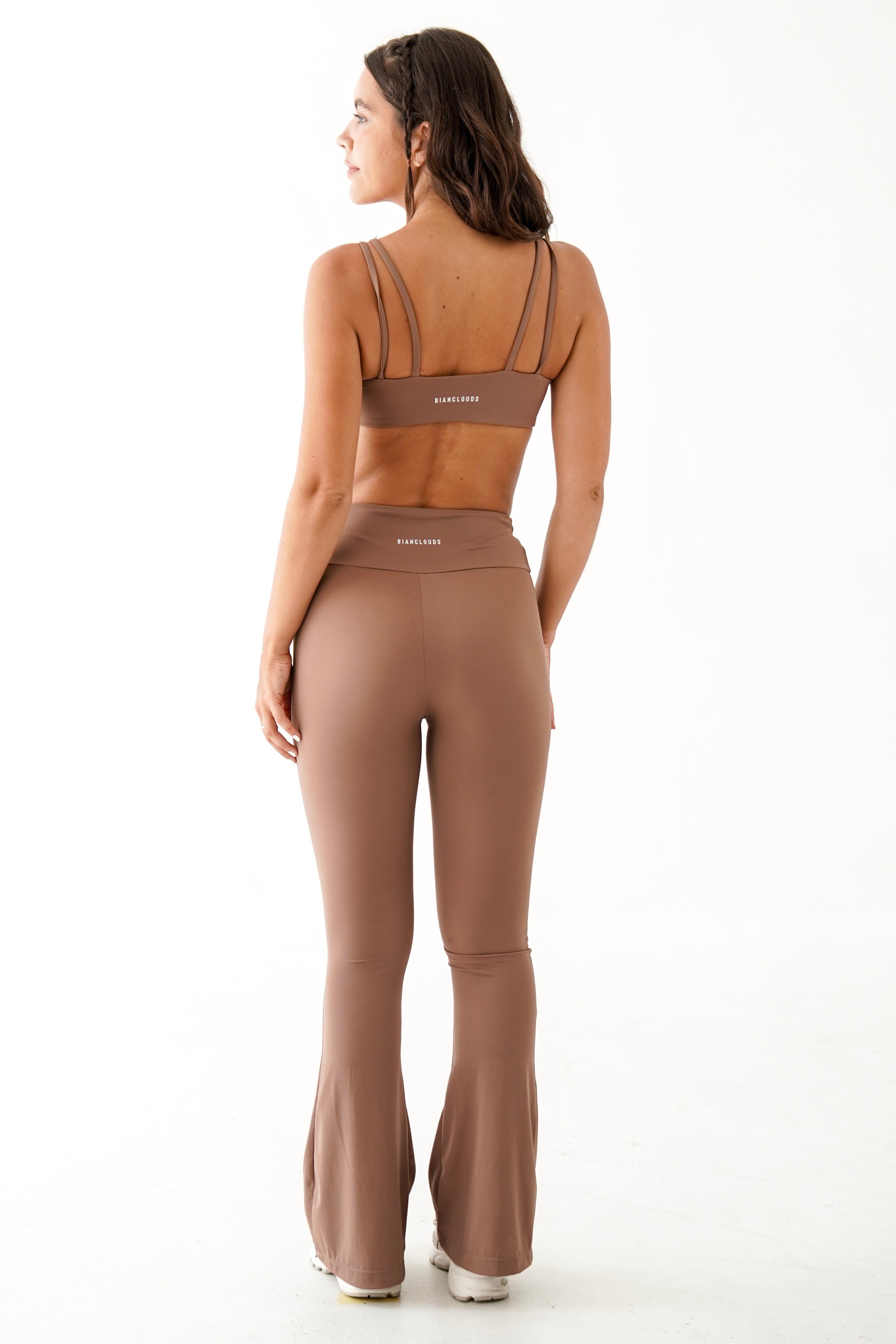 Woman wearing a brown yoga wear set