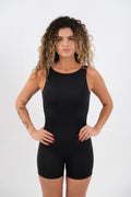 Woman wearing a black bodysuit do pilates