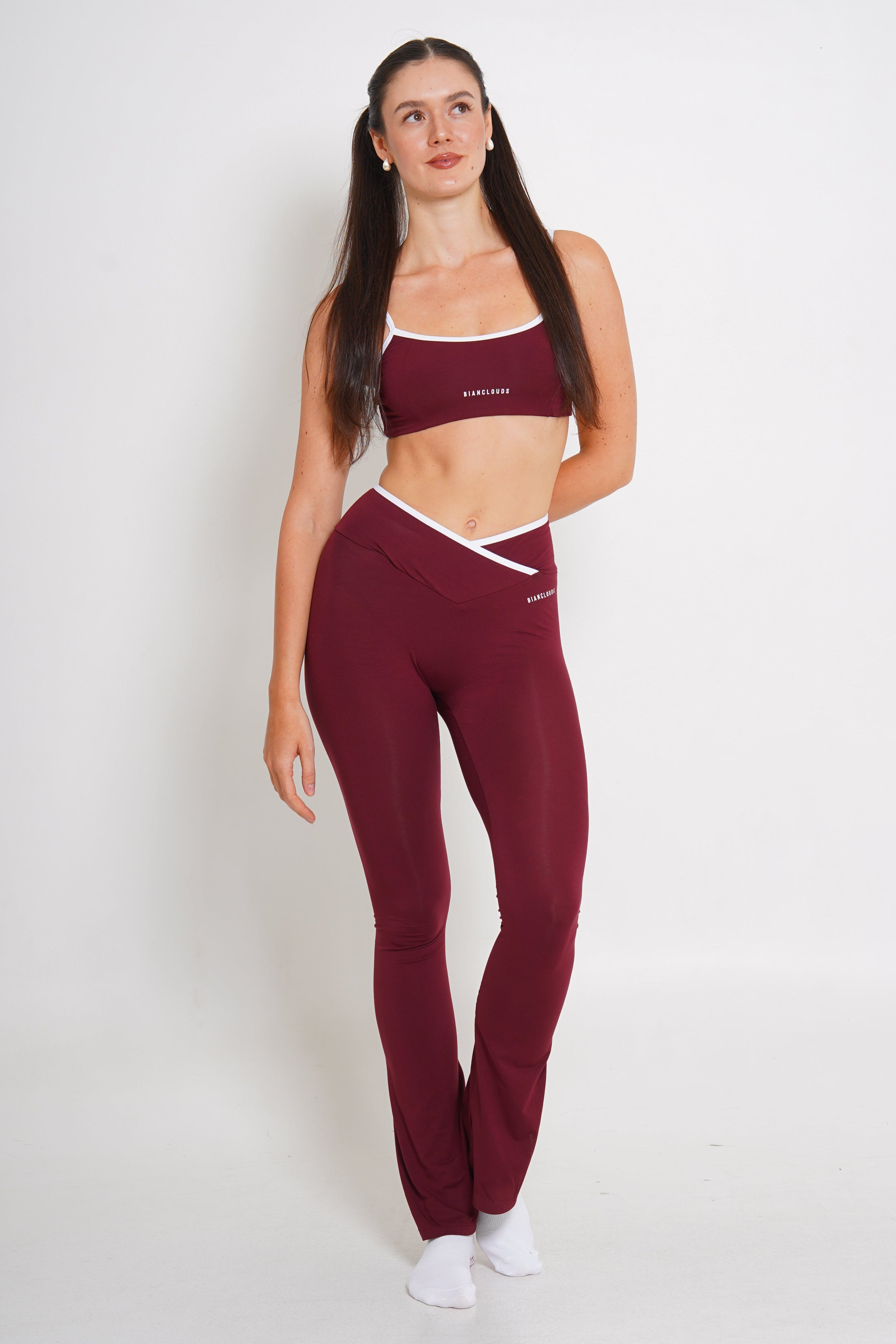Woman wearing a maroon loungewear outfit